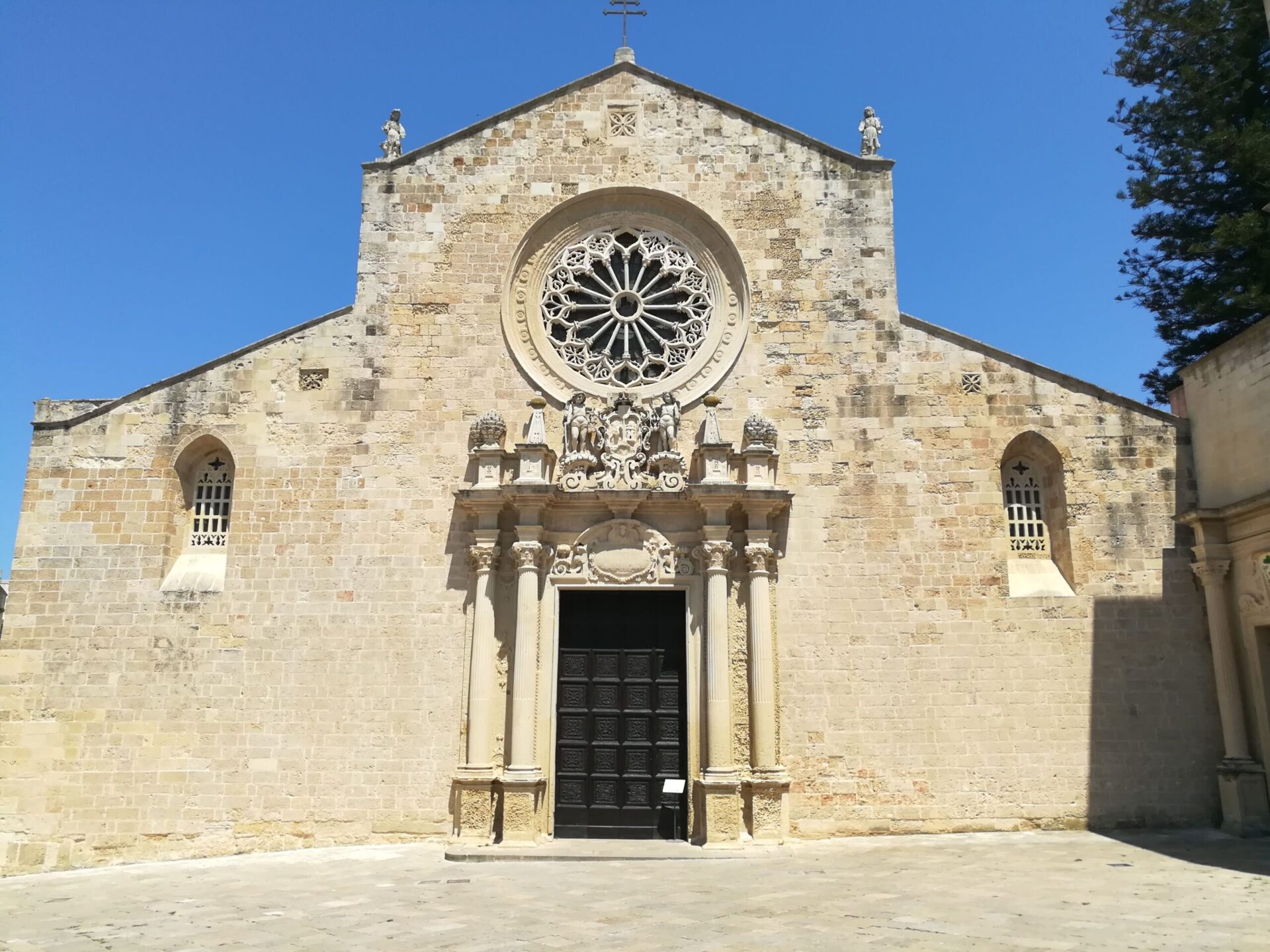 Otranto Cathedral Romanesque facade with rose window and side portal dedicated to the 813 Martyrs