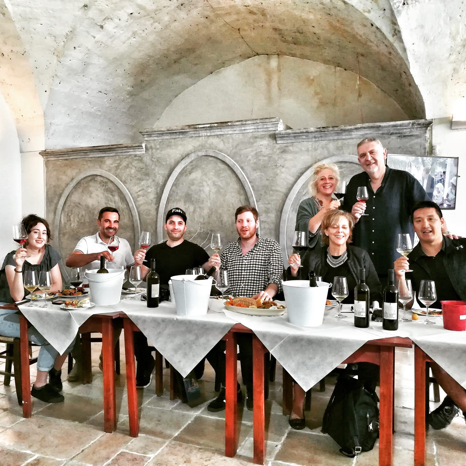 Joyful friends wine tasting at Guagnano Negroamaro Museum