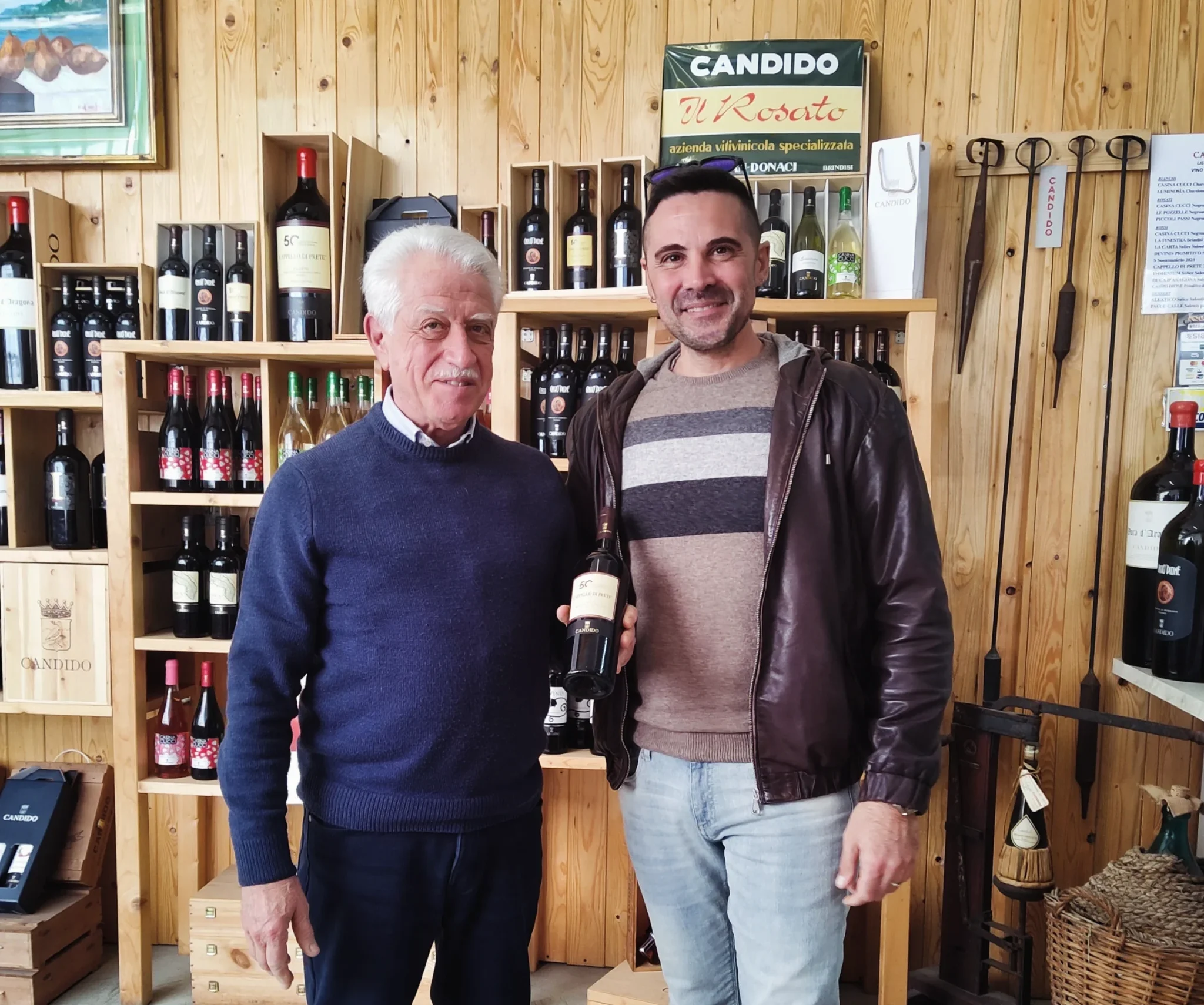 Francesco Candido in the historic cellar of San Donaci with old barrels