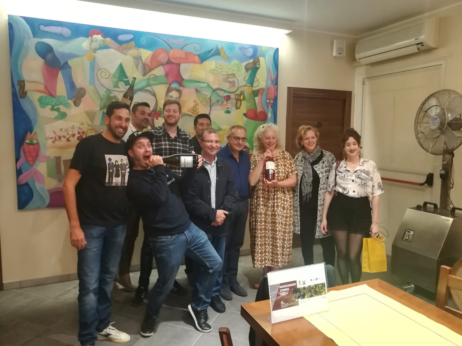 Group photo of international wine journalists and experts at Feudi di Guagnano winery during Negroamaro Stories tour