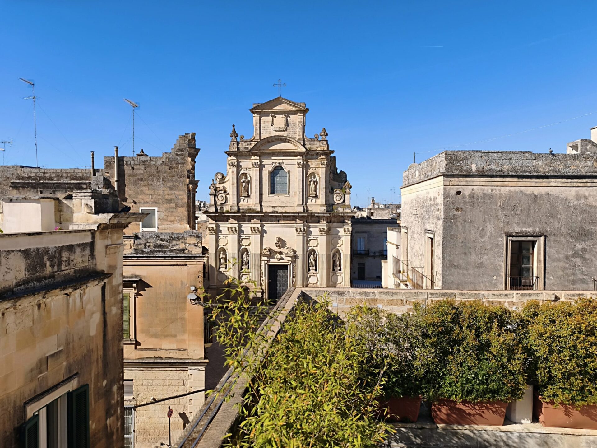 Rooftop terrace of Palazzo Guido overlooking Lecce's baroque church domes