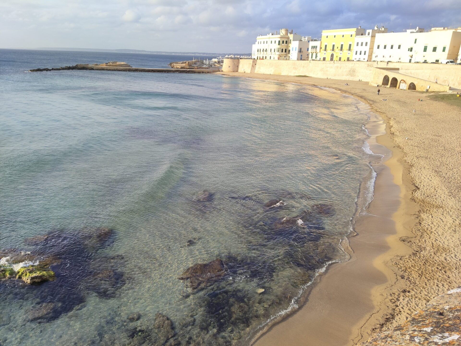 Panoramic view of Puritate Beach in Gallipoli with the ancient city walls and turquoise Ionian Sea