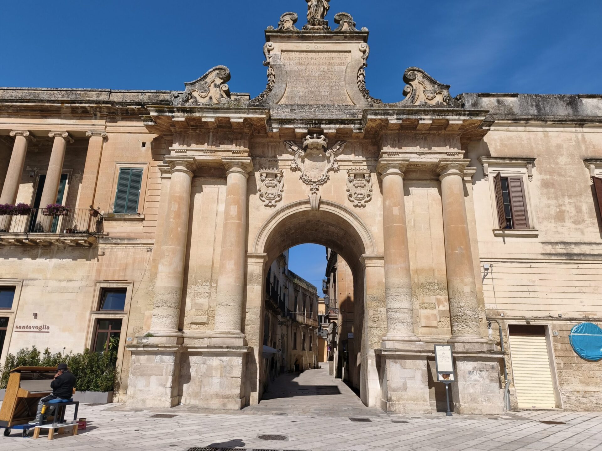 Porta San Biagio monumental gate in Lecce with Baroque stone carvings and arched passage